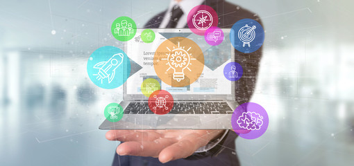 Poster - Businessman holding a Cloud of colorfull start up icon bubble with a laptop 3d rendering