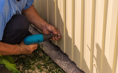 carpenters working with power tools,