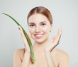 © artmim - Smiling woman with healthy skin and aloe vera leaf