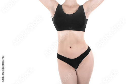 Fotografie, Obraz Female cropped fit body in black base underwear, isolated on white
