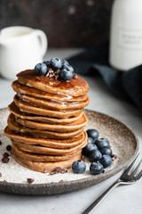 Wall Mural - Stack of buckwheat pancakes with blueberries and maple syrup. Gluten free vegan or vegetarian pancakes