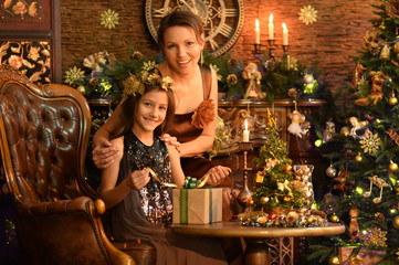 Wall Mural - Portrait of girl with her mother with gift