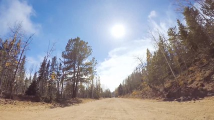Aufkleber - Driving on small mountain dirt roads from Colorado Springs to Cripple Creek in Autumn.