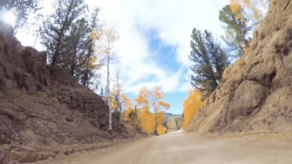Aufkleber - Driving on small mountain dirt roads from Colorado Springs to Cripple Creek in Autumn.