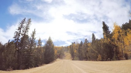 Aufkleber - Driving on small mountain dirt roads from Colorado Springs to Cripple Creek in Autumn.
