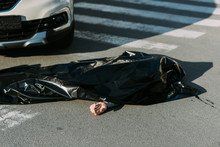 High Angle View Of Corpse And Car On Road After Traffic Accident
