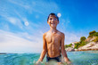 © Sergey Novikov - Cheerful boy playing in water at the seaside
