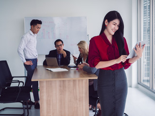 business people in meeting room,Business team explaining new business ideas,businesswoman use laptop in board room