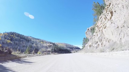 Aufkleber - Driving on small mountain dirt roads from Colorado Springs to Cripple Creek in Autumn.