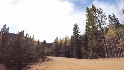 Aufkleber - Driving on small mountain dirt roads from Colorado Springs to Cripple Creek in Autumn.