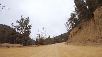 Aufkleber - Driving on small mountain dirt roads from Colorado Springs to Cripple Creek in Autumn.