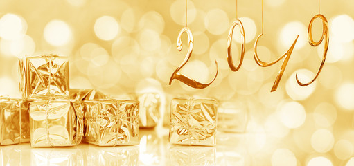 Wall Mural - 2019 new year card, small christmas gifts in shiny golden paper, bokeh lights background