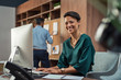 © Rido - Young businesswoman smiling at office