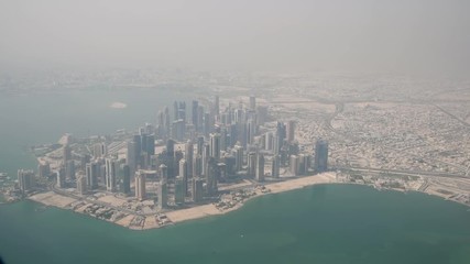 Wall Mural - Doha skyline from the airplane on a beautiful morning