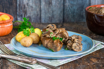 Sticker - Beef roulade staffed with mushrooms in creamy mushroom sauce served with boiled baby potatoes