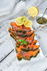 Canvas Print - Gravadlax - Nordic dish of thinly sliced raw salmon cured in salt, sugar and dill and accompanied by dill and mustard sauce - top view