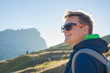 portrait of young smiling man hiking in Alta Badia, Dolomites