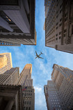 Fototapeta Nowy Jork - plane flies over the city over New York
