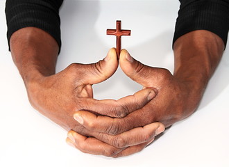 Hands with cross symbolizing love of god