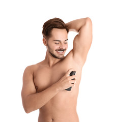 Poster - Young man using deodorant on white background