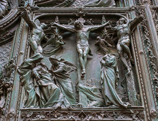 Detail of the Pieta scene in bas-relief at Milan's Cathedral doors