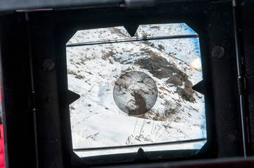 Wall Mural - look at the mountain scenery through the viewfinder of an old ca