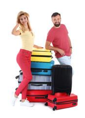 Wall Mural - Couple with suitcases on white background. Vacation travel