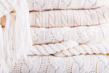 White Knits Pile. Warm Cozy Home Concept