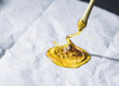 0.5 gram THC wax concentrate rosin isolated up close on wax paper with dab tool