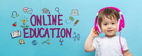 Online education with toddler boy with headphones on a blue background