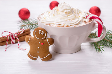 Wall Mural - Cup of  hot homemade chocolate drink with whipped creamand gingerbread cookies for christmas holiday. Holiday concept