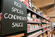 Rice, Spices, Condiments, Sauces Grocery Categoy Aisle At Supermarket