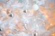 © Cg loser  - Christmas  background in white with white Christmas tree. closeup shot. blurred background