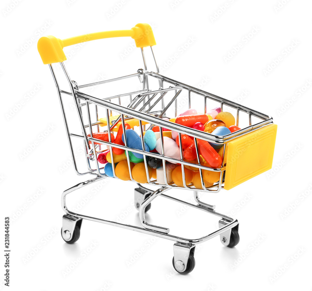 Shopping cart with color pills on white background