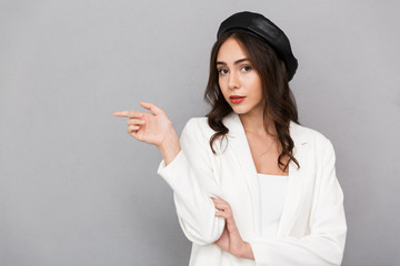 Portrait of a smiling young woman wearing beret