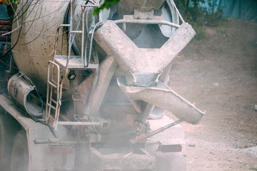 Dirty concrete mixer closeup.