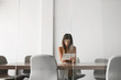 © LUMINA IMAGES - Pretty businesswoman sitting at meeting room and working on her tablet.