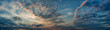 canvas print picture - Panorama evening sky with blue, white and orange clouds