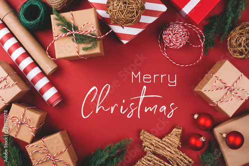 Christmas greeting card. Background with gift boxes, clews of rope, paper's r...