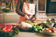 © karepa - Young Woman Cooking in the kitchen. Healthy Food for Christmas (stuffed duck or Goose)