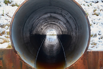 stream in the pipe under the road