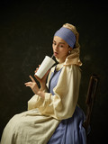Medieval Woman in Historical Costume Wearing Corset Dress and Bonnet. Beautiful peasant girl wearing thrush costume with Coca Cola