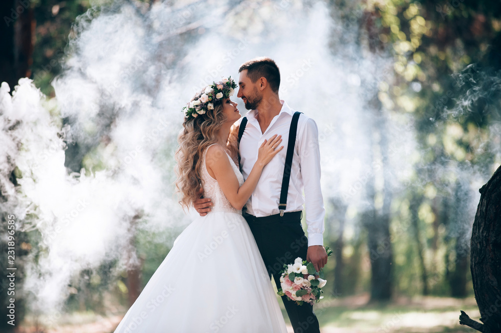 bride and groom on the background of fairy fog in the forest. Rustic wedding concept - obrazy, fototapety, plakaty 