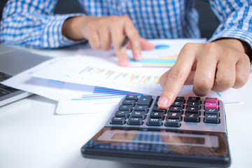 Poster - People are calculating financial data with calculator.