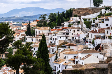 Beautiful aerial view city of Granada in a daytime. Granada - capital city of province of Granada, located at foot of Sierra Nevada Mountains. Granada, Andalusia, Spain.