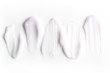 A group of textured strokes of moisturizers on a white background.