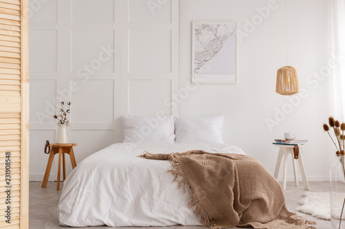 Map On The Wall Of Stylish Bedroom Interior With Big White
