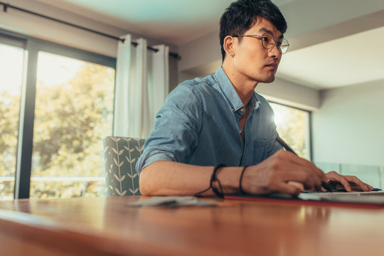Busy looking architect working at his desk