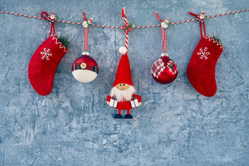 christmas background. red christmas decoration with santa claus on blue background. copy space.