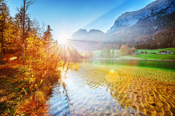 Hintersee - Amazing Alpine Lake in Germany, Bavaria Bundes land, Austria border. Picturesque scenery of lovely sunrise on the lake in Alps mountains. Scenic Seasonal Autumn Landscape Photography.